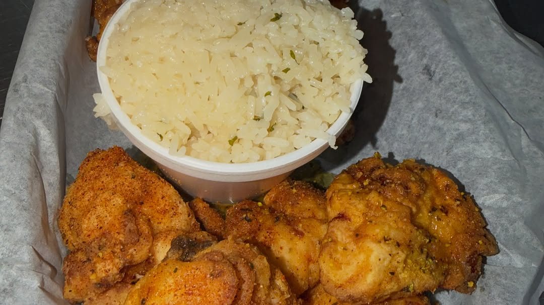 Boneless lemon pepper wings with a side of rice
