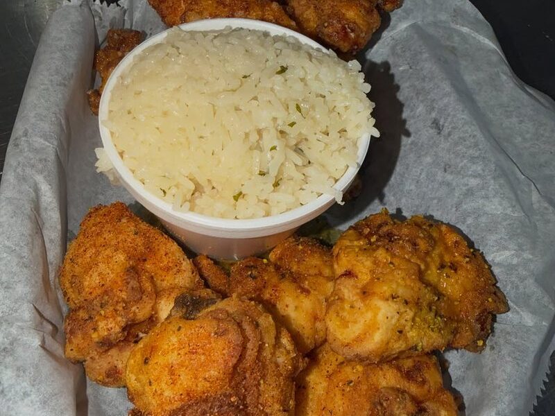Boneless lemon pepper wings with a side of cilantro-lime rice